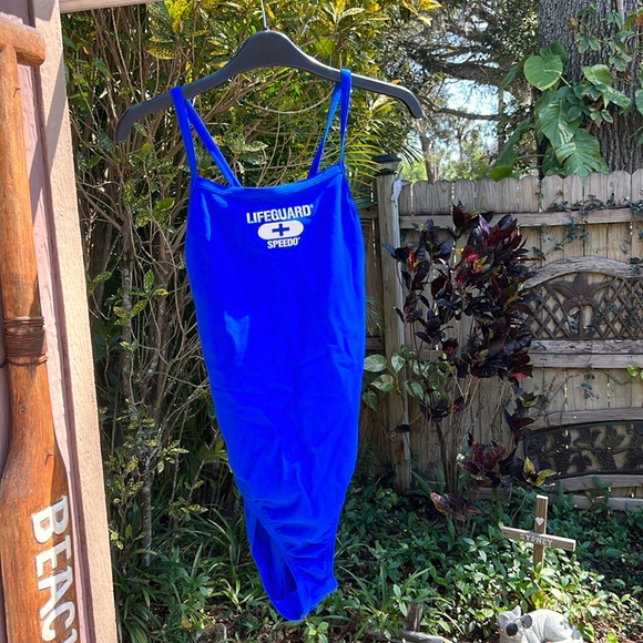 Speedo Other - NWOT Speedo Flyback 1 piece swimsuit with lifeguard logo on chest.